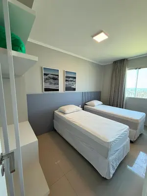 Uma cama ou camas num quarto em Frente ao Mar - Ilhota - Itapema