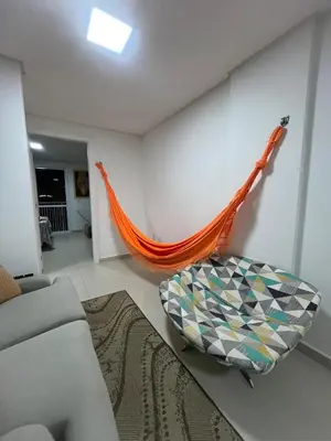 Uma área de estar em Apartamento simples em Porto Belo, 800 metros da praia