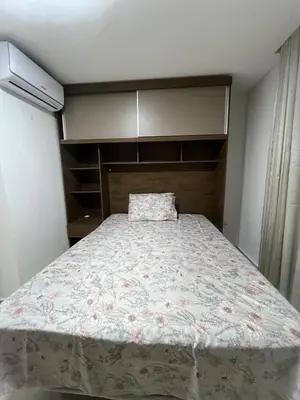 Uma cama ou camas num quarto em Apartamento simples em Porto Belo, 800 metros da praia