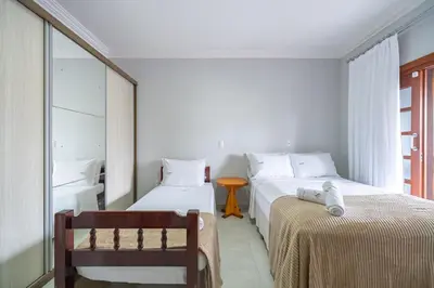 Uma cama ou camas num quarto em Achei Itapema • Casa, 4 suítes + Área Gourmet