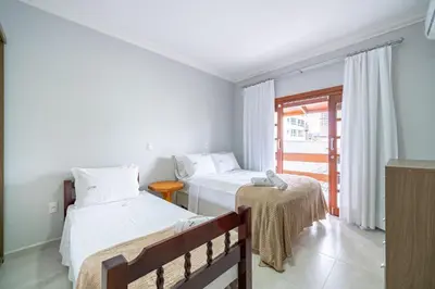 Uma cama ou camas num quarto em Achei Itapema • Casa, 4 suítes + Área Gourmet