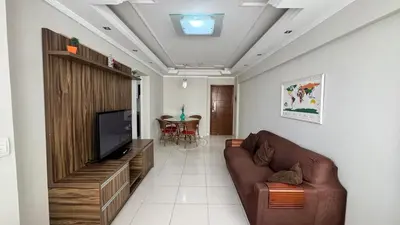 Uma televisão e/ou sistema de entretenimento em Apartamento Quadra Mar em Balneário Camboriú