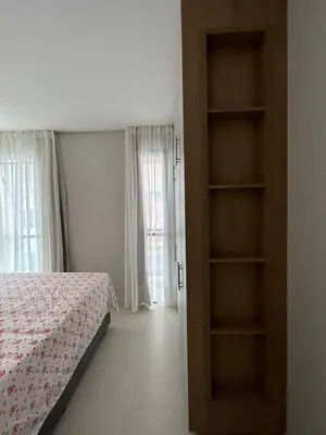 Uma cama ou camas num quarto em Apto Palmas - Refugio
