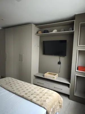 Uma cama ou camas num quarto em Apto Praia de Palmas
