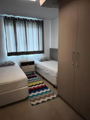 Uma cama ou camas num quarto em Apto Praia de Palmas