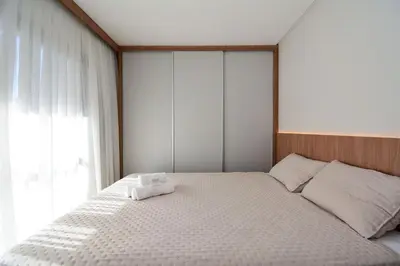 Uma cama ou camas num quarto em Aconchego Frente Mar na Praia de Palmas - GCR010