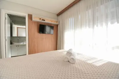 Uma cama ou camas num quarto em Aconchego Frente Mar na Praia de Palmas - GCR010