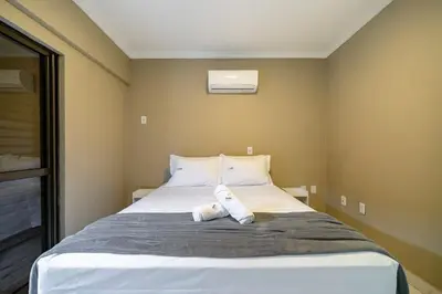 Uma cama ou camas num quarto em Achei Itapema • Monte Carlo AP003, R.279