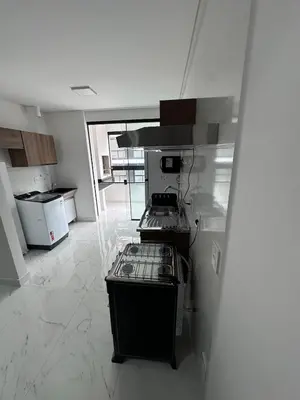 A cozinha ou kitchenette de Apt 2 suites Novo 180M da Praia Completo