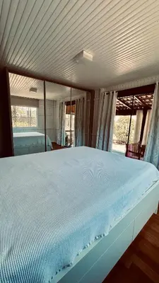 Uma cama ou camas num quarto em Casa Pena Branca Villa Ararybó