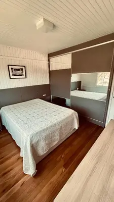 Uma cama ou camas num quarto em Casa Pena Branca Villa Ararybó
