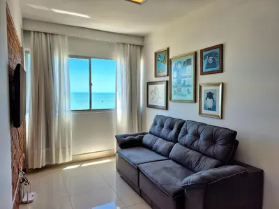 Uma área de estar em 2 Quartos Beira Mar & Pé na Areia |CURTA213