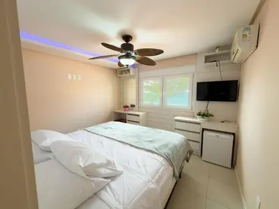 Uma cama ou camas num quarto em Casa Amalfi - Beira Mar de Bombinhas Centro