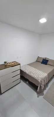 Uma cama ou camas num quarto em Apartamento Mobiliado 6 Lug Ar Condi garagem sacada