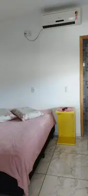 Uma cama ou camas num quarto em Apto D 1º Andar