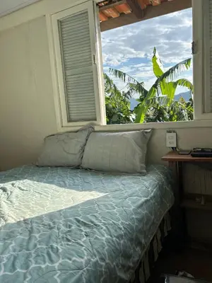Uma cama ou camas num quarto em Casa de Praia em Bombinhas com Vista 3 quartos
