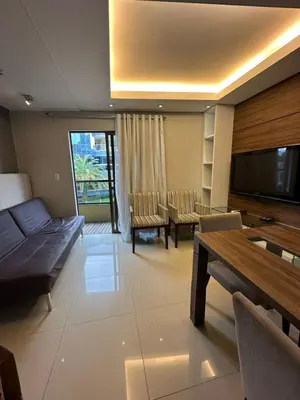 Uma televisão e/ou sistema de entretenimento em Apartamento Completo em Bombinhas - Atol das Rocas - SC