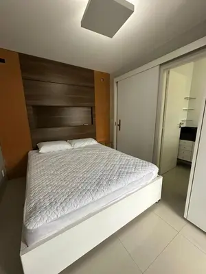 Uma cama ou camas num quarto em Apartamento Completo em Bombinhas - Atol das Rocas - SC