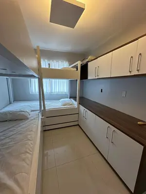 Uma cama ou camas num quarto em Apartamento Completo em Bombinhas - Atol das Rocas - SC