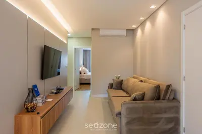 Uma televisão e/ou sistema de entretenimento em Apto c/ Churrasqueira a 500m da Praia TDF0302