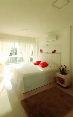 Uma cama ou camas num quarto em Cobertura duplex, vista panorâmica e SPA