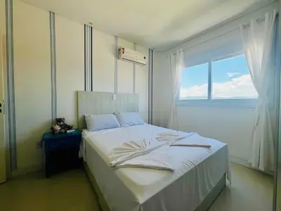Uma cama ou camas num quarto em Cobertura duplex, vista panorâmica e SPA