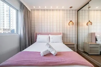 Uma cama ou camas num quarto em Achei Itapema • Chatêau Saint Michel, R.302