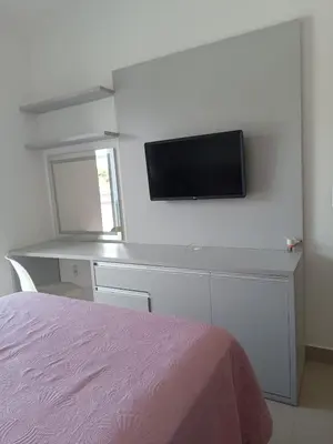 Uma televisão e/ou sistema de entretenimento em Casa linda e espaçosa ao lado do Morro para Bombinhas