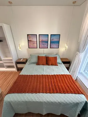 Uma cama ou camas num quarto em Cobertura Vista Mar-Premium na Meia Praia-12ºandar