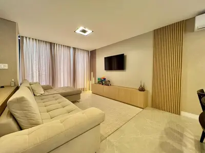 Uma televisão e/ou sistema de entretenimento em Casa para Temporada em Camboriú