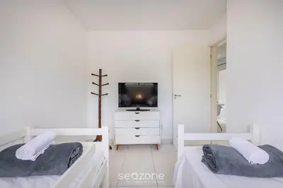 Uma cama ou camas num quarto em Apto c/ Churrasqueira a 750m da Praia EVP0504