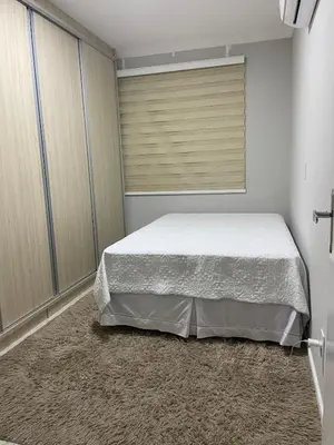 Uma cama ou camas num quarto em My casa, su casa! Meia Praia - Itapema