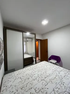 Uma cama ou camas num quarto em Aparatamento 3 dormitorios em Meia Praia - Itapema