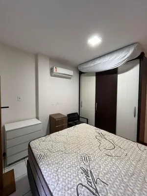 Uma cama ou camas num quarto em Aparatamento 3 dormitorios em Meia Praia - Itapema