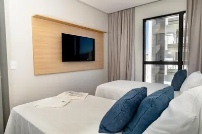 Uma cama ou camas num quarto em Apto 2003 - Frente mar, 200m da Praia, Restaurantes e Hard Rock Café