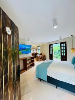Uma cama ou camas num quarto em Studio Com Hidro e Cromoterapia Baoba Suites