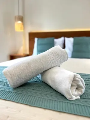 Uma cama ou camas num quarto em Studio Com Hidro e Cromoterapia Baoba Suites