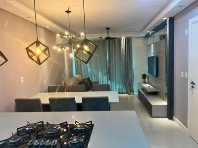 Uma área de estar em Plus Home Condominio na Praia de Perequê em Porto Belo