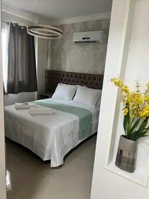 Uma cama ou camas num quarto em Plus Home Condominio na Praia de Perequê em Porto Belo