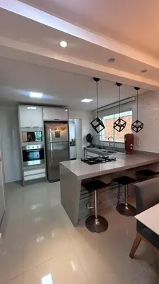 A cozinha ou kitchenette de Plus Home Condominio na Praia de Perequê em Porto Belo