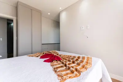 Uma cama ou camas num quarto em Cobertura Duplex 205
