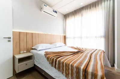 Uma cama ou camas num quarto em Cobertura Duplex 205