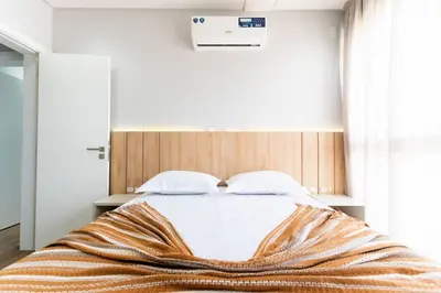 Uma cama ou camas num quarto em Cobertura Duplex 205