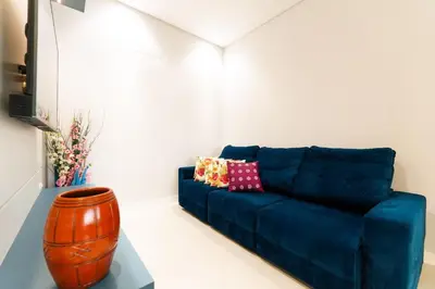 Uma área de estar em Cobertura Duplex 205