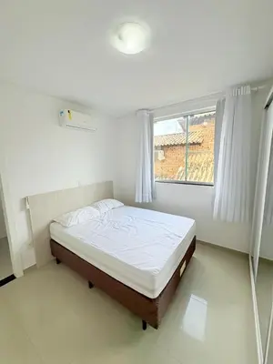 Uma cama ou camas num quarto em Ap perto do mar
