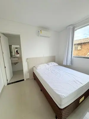 Uma cama ou camas num quarto em Ap perto do mar