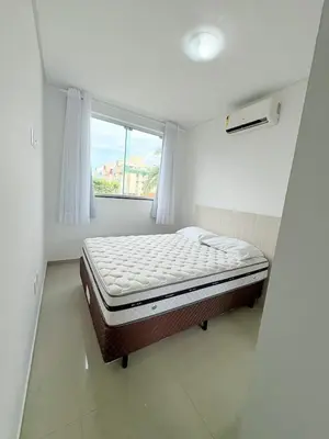 Uma cama ou camas num quarto em Ap perto do mar