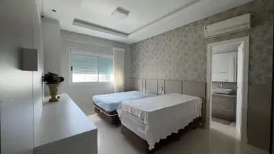 Uma cama ou camas num quarto em Apartamento vista Panorâmica do Mar em Meia Praia