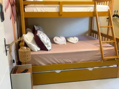 Uma cama ou camas num quarto em Casa ao mar -Pousada Itapema