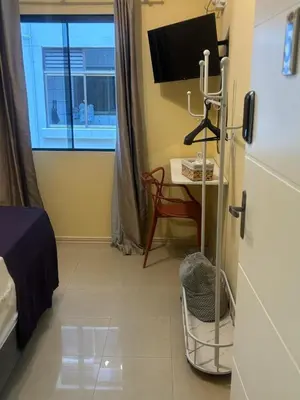 Uma televisão e/ou sistema de entretenimento em Casa ao mar -Pousada Itapema